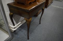 Mahogany occasional table.