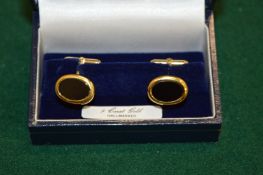 A pair of 9ct gold cufflinks.
