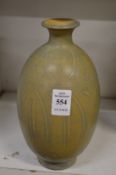 A Chinese bulbous shaped vase with incised decoration.