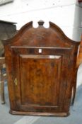 A good 18th century walnut hanging corner cupboard with broken arch pediment and fielded panelled