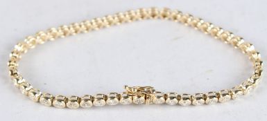 A 14CT YELLOW GOLD AND DIAMOND LINE BRACELET, approx. 3ct.