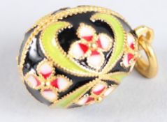 A RUSSIAN SILVER AND ENAMEL EGG PENDANT.