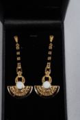 A PAIR OF SILVER AND GOLD PLATED ONYX AND OPAL DECO STYLE EARRINGS.