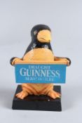 A CAST IRON GUINNESS PENGUIN. 6ins high.