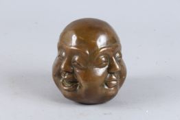 A CHINESE BRONZE FOUR FACED BUDDHA. 4ins high.