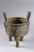 A CHINESE ARCHAIC THREE LEGGED CIRCULAR BRONZE KORO. 6.5ins diameter.