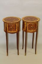 A PAIR OF LOUIS XVITH DESIGN CIRCULAR INLAID BEDSIDE CHESTS with three drawers, on slender legs. 2ft