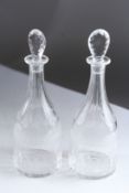 A GOOD PAIR OF GEORGIAN ENGRAVED DECANTERS AND STOPPERS.