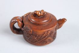 A SMALL HARDWOOD TEAPOT.