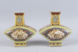 A PAIR OF CHINESE FAN SHAPED PORCELAIN VASES. 8.5ins high.