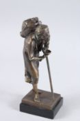 A BRONZE ARAB MAN with walking stick. 9ins high.