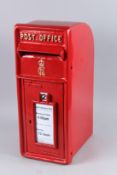 A RED CAST IRON POST BOX. 23ins long.