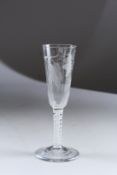A GEORGIAN ALE GLASS engraved with hops and white air twist stem. 7ins high.