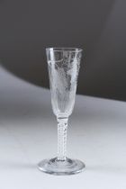 A GEORGIAN ALE GLASS engraved with hops and white air twist stem. 7ins high.