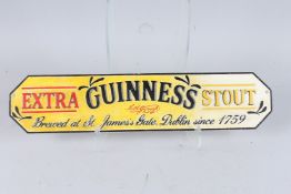 A CAST IRON GUINNESS SIGN. 22ins x 5ins.
