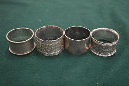 FOUR PLATED NAPKIN RINGS.