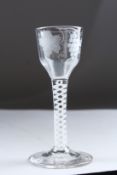 A GEORGIAN WINE GLASS, the bowl engraved with fruiting vines, with white air twist stem. 5.5ins