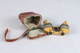 A VERY GOOD PAIR OF OPERA GLASSES by BON TURORZ, PARIS, in a leather case.