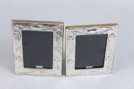 A PAIR OF SILVER PHOTOGRAPH FRAMES.