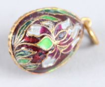 A RUSSIAN SILVER AND ENAMEL EGG PENDANT.
