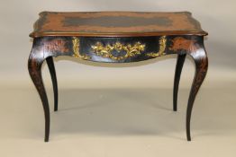 A 19TH CENTURY EBONY, MARQUETRY AND ORMOLU TABLE of serpentine outline, with a single frieze drawer,
