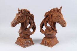 A PAIR OF CAST IRON HORSE'S HEADS. 17.5ins high.