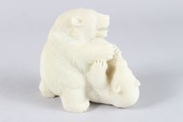 A WHITE JADE CARVING OF A PLAYFUL BEAR AND CUB. 5.5ins high.
