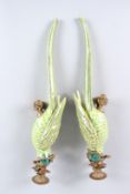 A GOOD PAIR OF SEVRES DESIGN GREEN PARROT WALL SCONCES with gilt metal sconces. 19ins high.