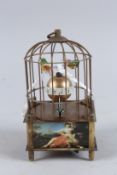 A SMALL BIRD CAGE CLOCK. 6ins high.