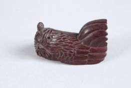 A CARVED WOOD CHICKEN NETSUKE. 2.25ins high.