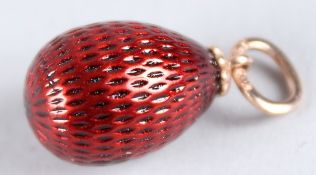 A RUSSIAN RED ENAMEL EGG PENDANT.