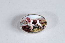 A SILVER OVAL PILL BOX with a spaniel.
