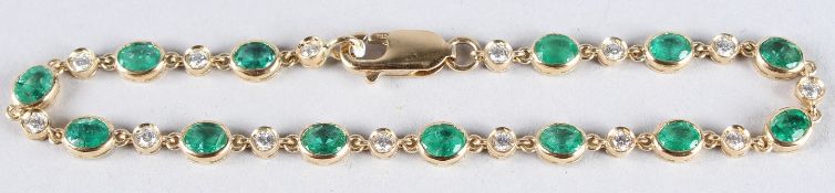 AN 18CT GOLD, EMERALD AND DIAMOND LINE BRACELET.