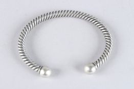 A STERLING SILVER HEAVY TWIST TORQUE BRACELET.