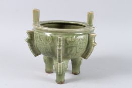 A CHINESE GREEN GLAZED CIRCULAR CENSER on three legs. 7.5ins.