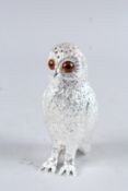 A SILVER PLATED OWL SUGAR SIFTER.