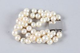 A TRIPLE ROW OF FORTY-EIGHT PEARLS BRACELET with 18ct white gold clasp.