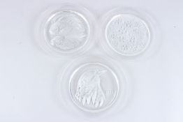 A SET OF THREE LALIQUE TYPE BIRD PLATES, 1969, 1970 and 1971. 8ins diameter.