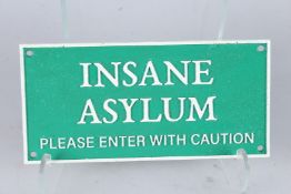 A CAST IRON INSANE ASYLUM SIGN. 5ins x 10ins.