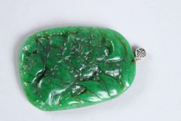 A CARVED JADE PENDANT.