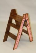 A BOLLINGER WOODEN FOLDING LADDER. 2ft 10ins high.