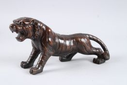 A BRONZE TIGER. 12ins long.