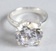 A SILVER AND CZ SOLITAIRE RING.