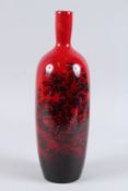 A ROYAL DOULTON FLAMBE WARE NO. 1617 TALL VASE. 13.5ins high.