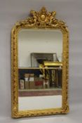 A GOOD LOUIS XVITH STYLE GILTWOOD UPRIGHT CUPID MIRROR. 6ft high x 3ft wide.