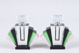 A SMALL PAIR OF ART DECO DESIGN BLACK, GREEN AND PINK FAN SHAPED SCENT BOTTLES. 5ins high.