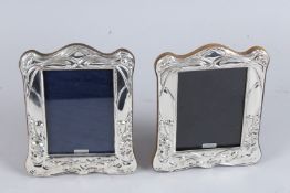 A PAIR OF SILVER PHOTOGRAPH FRAMES.