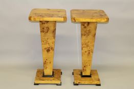 A PAIR OF ART DECO DESIGN MAPLEWOOD SQUARE TOP STANDS. 2ft 8ins high x 1ft 3ins square.