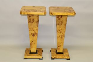 A PAIR OF ART DECO DESIGN MAPLEWOOD SQUARE TOP STANDS. 2ft 8ins high x 1ft 3ins square.