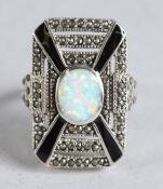 A SILVER, ONYX AND OPAL RING.